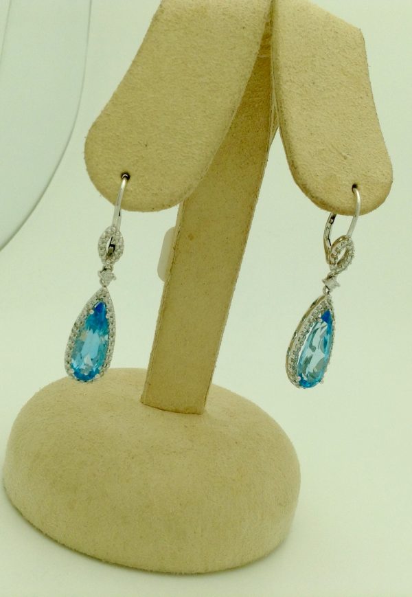 7.00 Ct Blue Topaz with 0.76 Ct Diamond Short Drop Earrings 14k hanging on carton ears