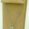 2.50 Ct Aquamarine with 0.26 Ct Diamonds Classy Retro Necklace 18k hanging on a piece carton