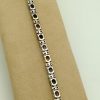 9.50 Ct Unheated Sapphire and 1.14 Ct Diamond Contemporary Bracelet 14k on a piece of carton