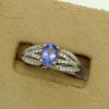 0.25 Ct Tanzanite and 0.44 Ct Diamond Contemporary Ring 14k on a box