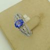 0.25 Ct Tanzanite and 0.44 Ct Diamond Contemporary Ring 14k on a carton box