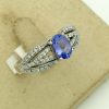 0.25 Ct Tanzanite and 0.44 Ct Diamond Contemporary Ring 14k on a box