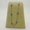0.25 Carat Diamonds Retro Necklace hanging on carton