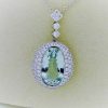 27.00 carat Aquamarine and 2.40 carat Diamond Triple Halo Necklace on a carton neck