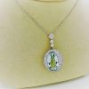 27.00 carat Aquamarine and 2.40 carat Diamond Triple Halo Necklace on a carton neck
