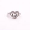 Front view of a ring with 1 small heart inside a bigger heart with gemstones