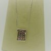 6.00 Ct Sapphire Pendant 0.75 Ct Diamonds 14k on a piece of carton