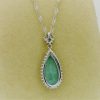 5.00 Ct Blue Topaz with 0.10 Ct Diamond Halo Pendant 14k Includes 14k Chain on a piece of carton