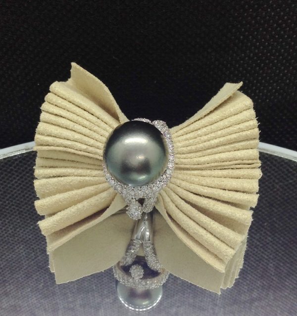 Magnificent 12mm Tahitian Pearl with 1.40 Ct Diamond 18k White Gold Ring on a piece of glass (front view)