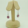 14K White Gold 2.0 CT Pink Sapphire Flower Earrings W/ 1.04 CT VS Diamond Halo hanging on fake ears