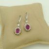 14K White Gold 2.0 CT Pink Sapphire Flower Earrings W/ 1.04 CT VS Diamond Halo on a pillow