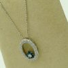 14k white gold diamond and sapphire necklace on a fake carton neck