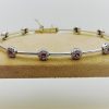 18Kt White Gold With 1.00Ct Tw of Diamond and .75Ct Sapphires Bracelet on a piece of carton