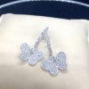 3.00 Ct Diamond Pave Butterfly 18k White Gold Dangle Earrings with Diamond Hoops on a pillow