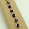 Good Luck 18K Yellow Gold Evil Eye Bracelet Mariner Clasp on a strap