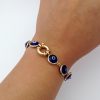 Good Luck 18K Yellow Gold Evil Eye Bracelet Mariner Clasp on a hand