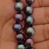 A woman holding Elegant 9.5mm Black Tahitian Pearls w/ Screw inside Pearls Stunning