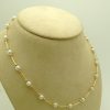 Classy 4mm Akoya Pearls w/ 14k yellow gold beads and bars on a fake neck