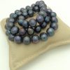 Elegant 12mm Black Tahitian Pearls w/ 14k White Gold Clasp on a pillow