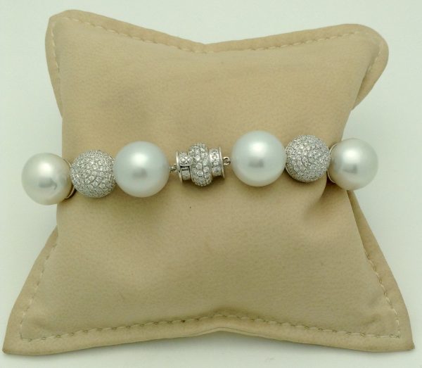 Unique 18k White Gold 6.00 Ct Diamond and 6mm South Sea Pearl Bracelet on a pillow