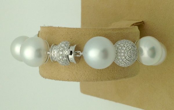 Unique 18k White Gold 6.00 Ct Diamond and 6mm South Sea Pearl Bracelet on a jewelry box