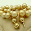 Golden South Sea Pearls 16mm 18k Yellow gold Clasp w/ VS Diamonds accents on a pillow