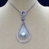 Front view of 18.7 Ct Mabe Pearl with 1.00 Ct Diamond 14k White Gold Pendant with 16" 14k White Gold Chain hanging on a fake neck