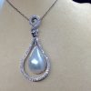 18.7 Ct Mabe Pearl with 1.00 Ct Diamond 14k White Gold Pendant with 16" 14k White Gold Chain hanging on a fake neck