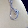 18.7 Ct Mabe Pearl with 1.00 Ct Diamond 14k White Gold Pendant with 16" 14k White Gold Chain hanging on a fake neck