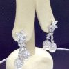 7.34 Ct Diamonds with 10mm South Sea Pearls Medium Dangle Platinum Earrings hanging on fake ears