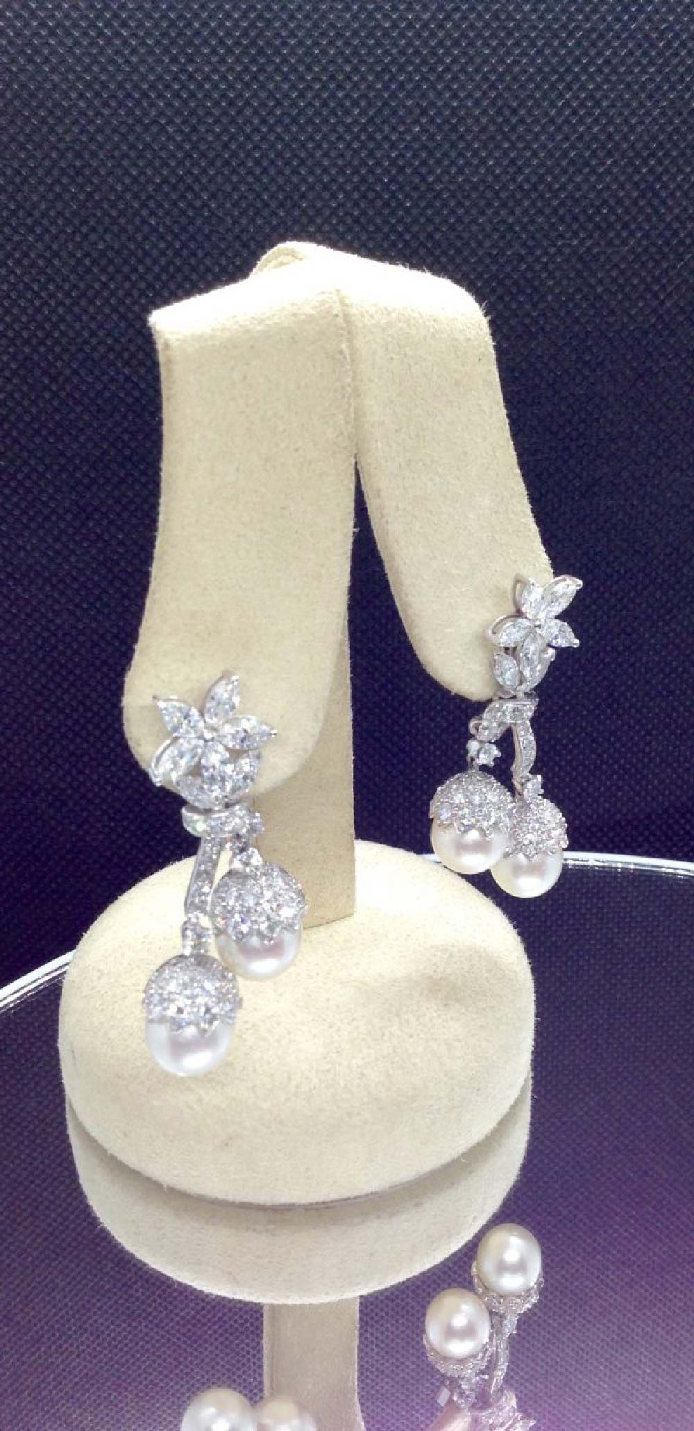 7.34 Ct Diamonds with 10mm South Sea Pearls Medium Dangle Platinum Earrings hanging on fake ears